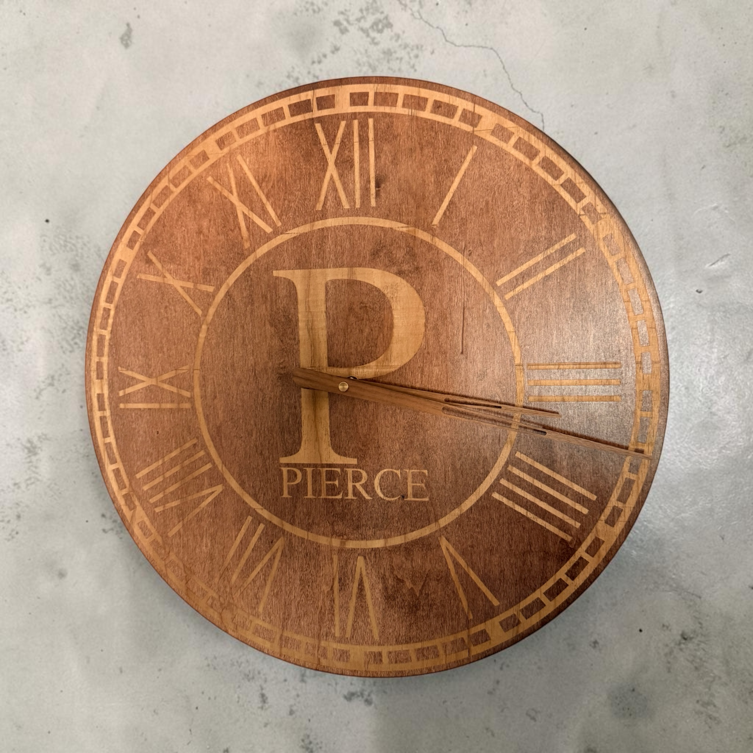 Personalized wooden wall clock with an engraved family name